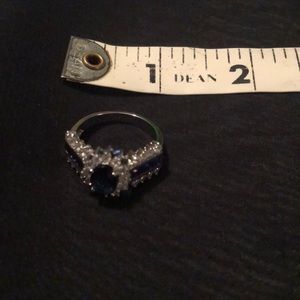 Described on purchase as 14K white gold plated ring with blue CZ